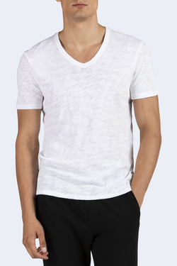 man in Men's V-Neck Cotton T-Shirt in White and black pants