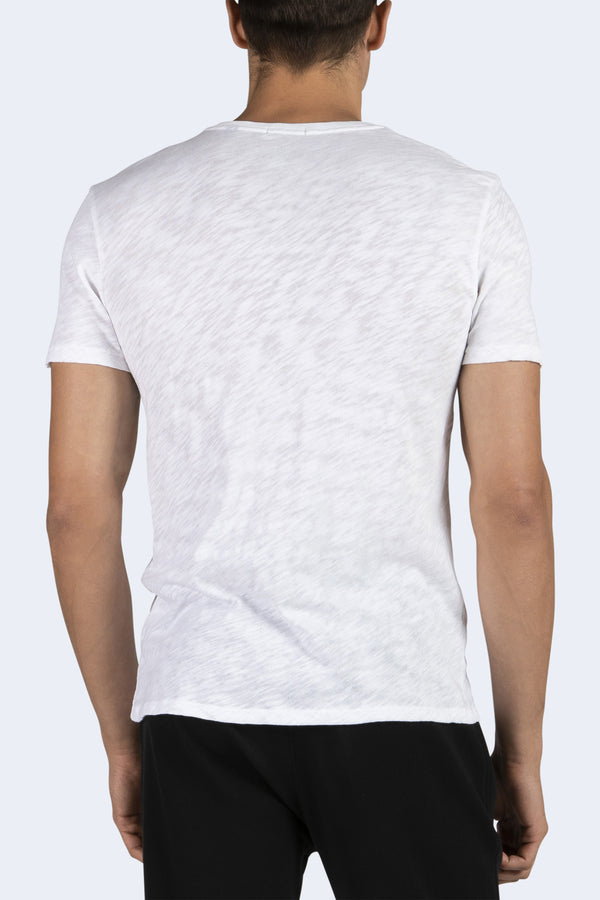 person wearing Men's V-Neck Cotton T-Shirt in White and black pants