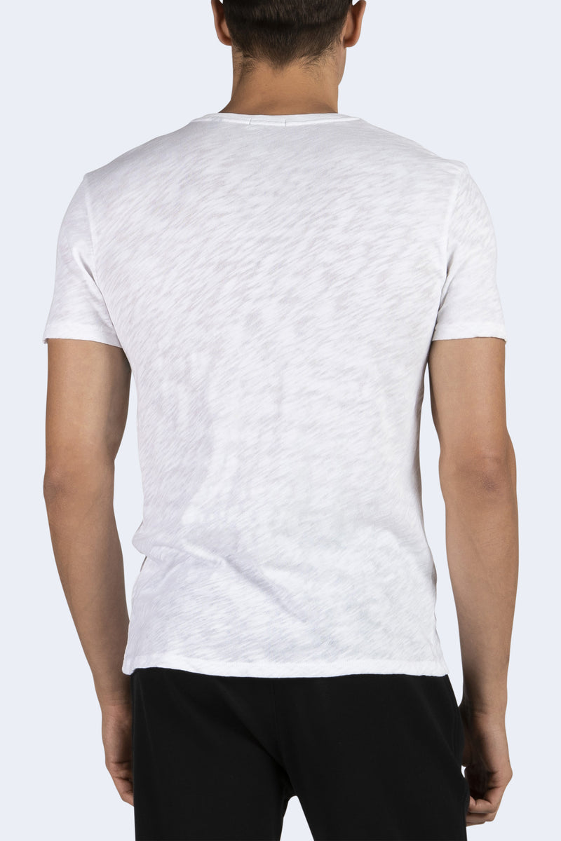 person wearing Men's V-Neck Cotton T-Shirt in White and black pants